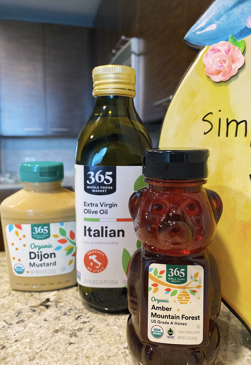Olive Oil, Honey and Mustard ingredients out on a counter