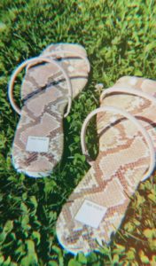 Image of a pair of Dolce Vita sandals in grass