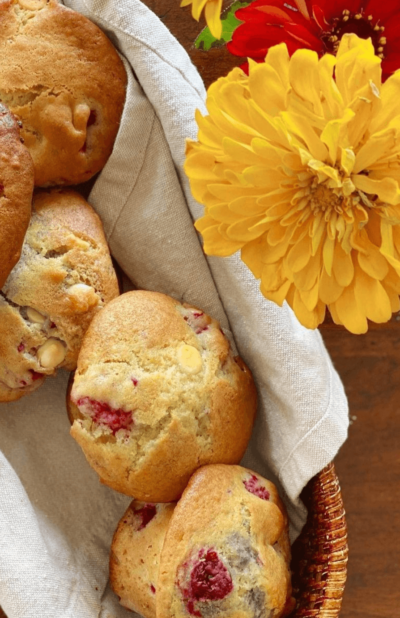 Close up image of raspberry, blueberry and white chocolate chip muffins
