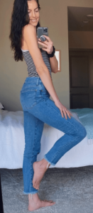 Image of Maddie Taking a picture in tank and cropped jeans