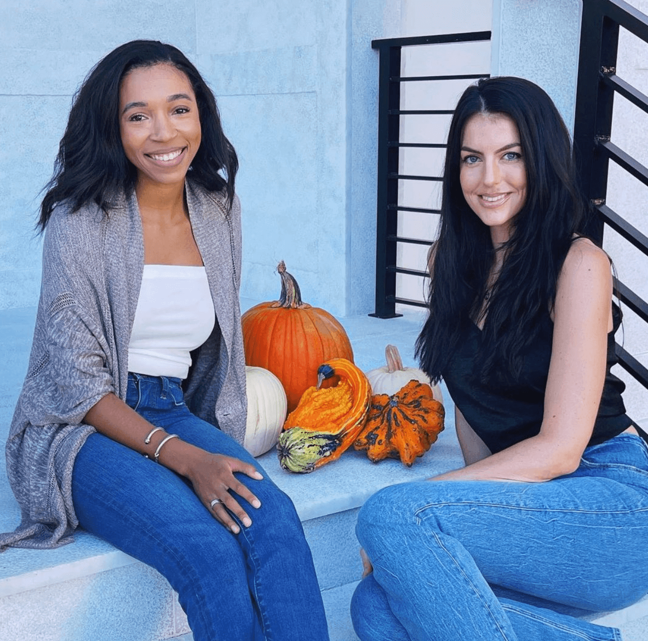 Image of Sara and Maddie sitting with Pumpkins
