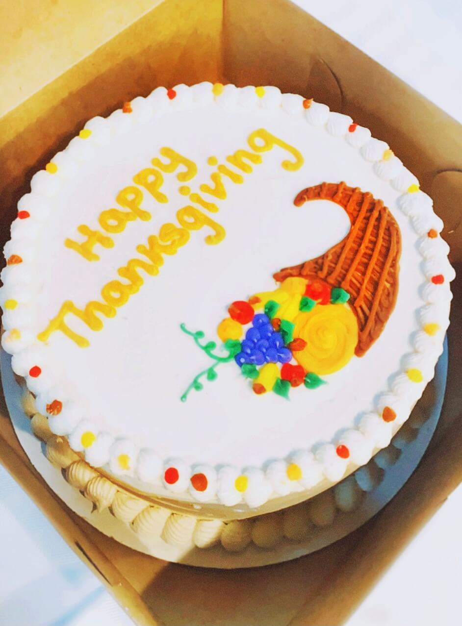 Image of a cake that says happy thanksgiving on it