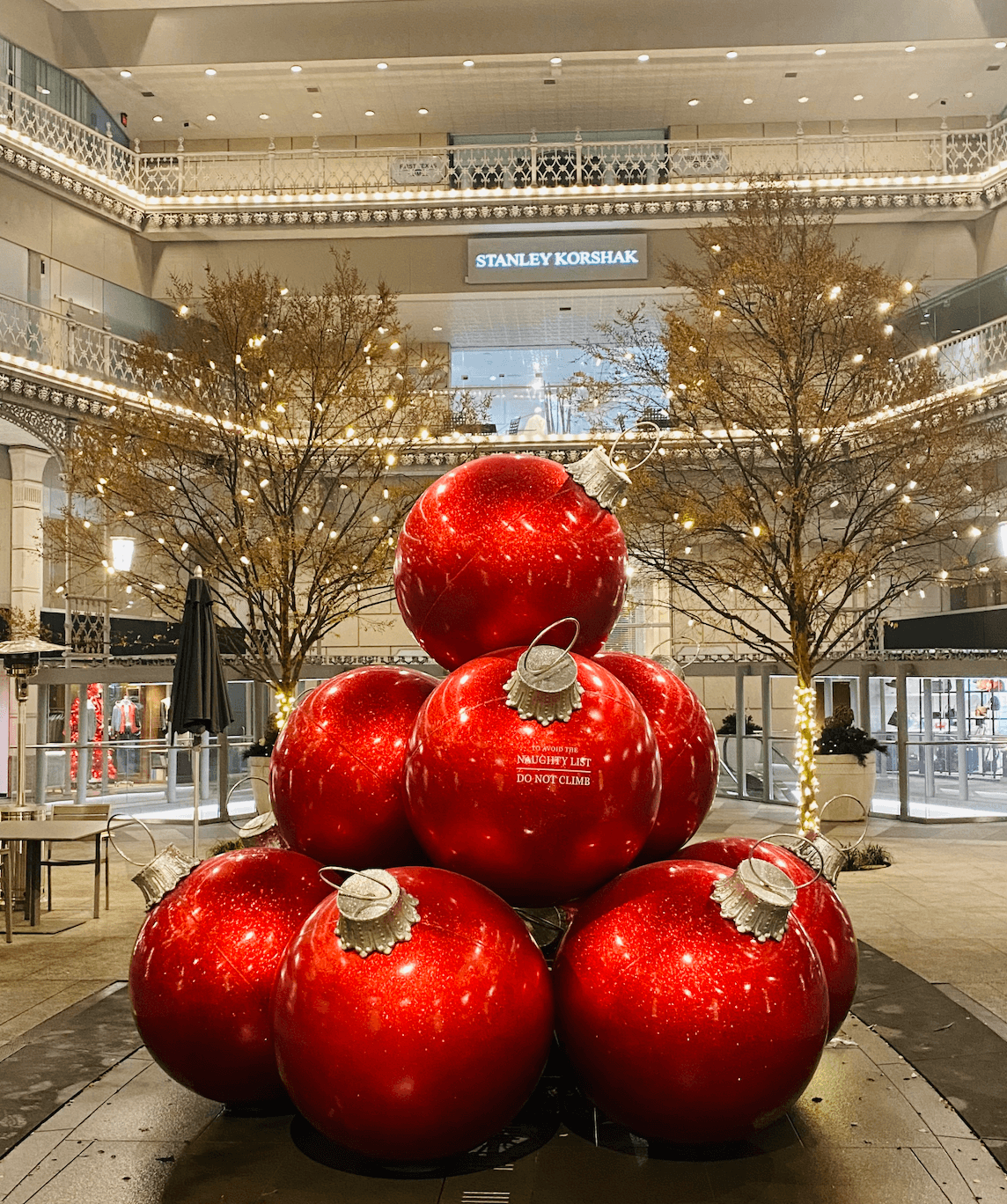 Image of Red Oversized Holiday Ornaments in a shopping center