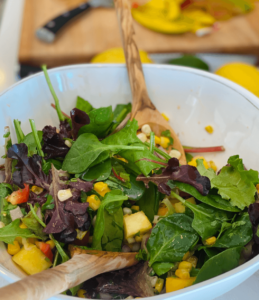 Image of the tropical salad with mango in the background 