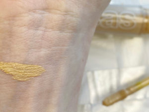 Image of Maddie's wrist with KOSAS concealer on it
